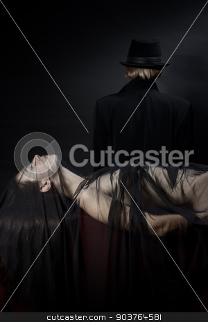 To use this stock image in your creative project, please select the size you need over to the right and click the "Add to Cart" button.
Your downloaded image will come with the Cutcaster watermark removed so don’t worry about the watermark you see on this page. victim of a vampire stock photo, beautiful young nude girl lying on the red fabric, covered with a light black cloth. In the background is the person in a black hat and cloak. by Suchota