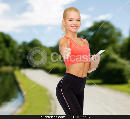 To use this stock image in your creative project, please select the size you need over to the right and click the "Add to Cart" button.
Your downloaded image will come with the Cutcaster watermark removed so don’t worry about the watermark you see on this page. smiling sporty woman with smartphone stock photo, sport, fitness, technology, internet and healthcare concept - smiling sporty woman with smartphone showing thumbs up by Syda Productions