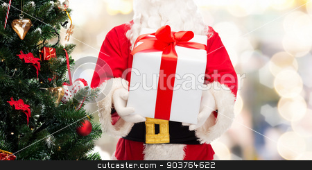 To use this stock image in your creative project, please select the size you need over to the right and click the "Add to Cart" button.
Your downloaded image will come with the Cutcaster watermark removed so don’t worry about the watermark you see on this page. man in costume of santa claus with gift box stock photo, christmas, holidays and people concept - close up of santa claus with gift box and tree over lights background by Syda Productions
