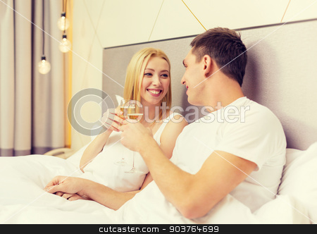 To use this stock image in your creative project, please select the size you need over to the right and click the "Add to Cart" button.
Your downloaded image will come with the Cutcaster watermark removed so don’t worry about the watermark you see on this page. smiling couple with champagne glasses in bed stock photo, hotel, travel, relationships and happiness concept - smiling couple with champagne glasses in bed by Syda Productions