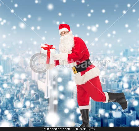 To use this stock image in your creative project, please select the size you need over to the right and click the "Add to Cart" button.
Your downloaded image will come with the Cutcaster watermark removed so don’t worry about the watermark you see on this page. man in costume of santa claus with gift box stock photo, christmas, holidays and people concept - man in costume of santa claus running with gift box over snowy city background by Syda Productions