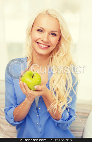 To use this stock image in your creative project, please select the size you need over to the right and click the "Add to Cart" button.
Your downloaded image will come with the Cutcaster watermark removed so don’t worry about the watermark you see on this page. smiling woman with green apple at home stock photo, diet, health and home concept - smiling yoing woman with green apple at home by Syda Productions