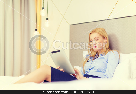 To use this stock image in your creative project, please select the size you need over to the right and click the "Add to Cart" button.
Your downloaded image will come with the Cutcaster watermark removed so don’t worry about the watermark you see on this page. happy businesswoman with tablet pc in hotel room stock photo, business, technology, internet and hotel concept - happy businesswoman with tablet pc computer lying in hotel in bed by Syda Productions