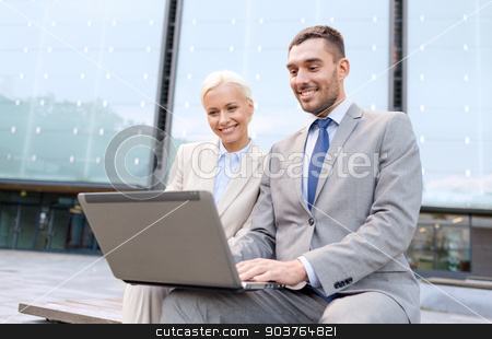 To use this stock image in your creative project, please select the size you need over to the right and click the "Add to Cart" button.
Your downloaded image will come with the Cutcaster watermark removed so don’t worry about the watermark you see on this page. smiling businesspeople with laptop outdoors stock photo, business, education, technology and people concept - smiling businesspeople working with laptop computer on city street by Syda Productions