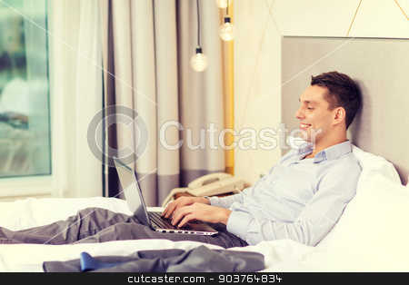 To use this stock image in your creative project, please select the size you need over to the right and click the "Add to Cart" button.
Your downloaded image will come with the Cutcaster watermark removed so don’t worry about the watermark you see on this page. happy businesswoman with laptop in hotel room stock photo, business, technology, internet and hotel concept - happy businessman with laptop computer lying in hotel in bed by Syda Productions