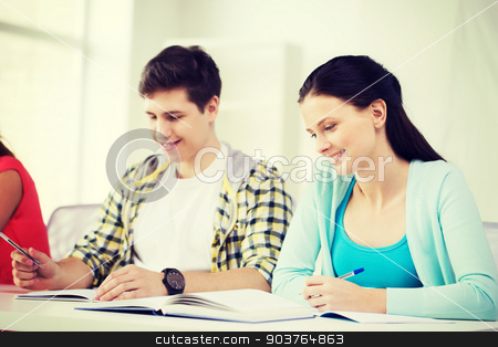 To use this stock image in your creative project, please select the size you need over to the right and click the "Add to Cart" button.
Your downloaded image will come with the Cutcaster watermark removed so don’t worry about the watermark you see on this page. students with textbooks and books at school stock photo, education and school concept - two smiling students with textbooks and books at school by Syda Productions