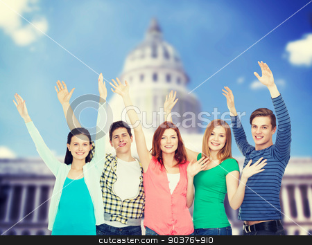 To use this stock image in your creative project, please select the size you need over to the right and click the "Add to Cart" button.
Your downloaded image will come with the Cutcaster watermark removed so don’t worry about the watermark you see on this page. group of smiling students waving hands stock photo, education and people concept - group of smiling students standing and waving hands by Syda Productions