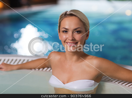 To use this stock image in your creative project, please select the size you need over to the right and click the "Add to Cart" button.
Your downloaded image will come with the Cutcaster watermark removed so don’t worry about the watermark you see on this page. happy woman sitting in jacuzzi at poolside stock photo, people, beauty, spa, healthy lifestyle and relaxation concept - beautiful young woman wearing bikini swimsuit sitting in jacuzzi at poolside by Syda Productions