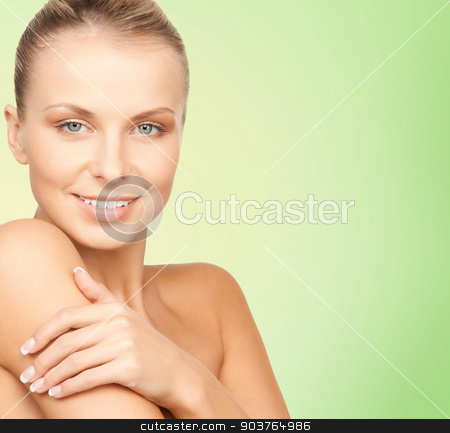 To use this stock image in your creative project, please select the size you need over to the right and click the "Add to Cart" button.
Your downloaded image will come with the Cutcaster watermark removed so don’t worry about the watermark you see on this page. beautiful young woman with bare shoulders stock photo, beauty, people and health concept - beautiful young woman with bare shoulders over green background by Syda Productions