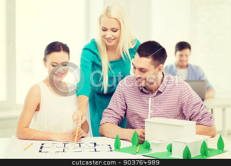 To use this stock image in your creative project, please select the size you need over to the right and click the "Add to Cart" button.
Your downloaded image will come with the Cutcaster watermark removed so don’t worry about the watermark you see on this page. smiling architects working in office stock photo, startup, education, architecture and office concept - smiling architects with house model and blueprint working in office by Syda Productions