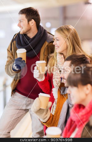 To use this stock image in your creative project, please select the size you need over to the right and click the "Add to Cart" button.
Your downloaded image will come with the Cutcaster watermark removed so don’t worry about the watermark you see on this page. happy friends with coffee cups on skating rink stock photo, people, friendship, hot drinks and leisure concept - happy friends drinking from paper coffee cups on skating rink by Syda Productions