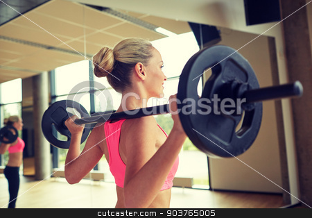 To use this stock image in your creative project, please select the size you need over to the right and click the "Add to Cart" button.
Your downloaded image will come with the Cutcaster watermark removed so don’t worry about the watermark you see on this page. sporty woman exercising with barbell in gym stock photo, fitness, sport, powerlifting and people concept - sporty woman exercising with barbell in gym by Syda Productions