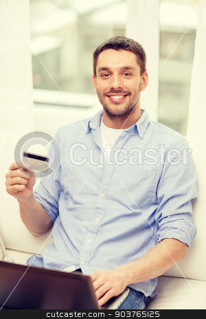 To use this stock image in your creative project, please select the size you need over to the right and click the "Add to Cart" button.
Your downloaded image will come with the Cutcaster watermark removed so don’t worry about the watermark you see on this page. smiling man working with laptop and credit card stock photo, technology, home and lifestyle concept - smiling man working with laptop and credit card at home by Syda Productions