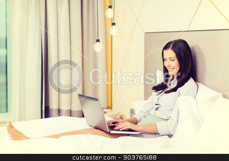 To use this stock image in your creative project, please select the size you need over to the right and click the "Add to Cart" button.
Your downloaded image will come with the Cutcaster watermark removed so don’t worry about the watermark you see on this page. happy businesswoman with laptop in hotel room stock photo, business, technology, internet and hotel concept - happy businesswoman with laptop computer lying in hotel in bed by Syda Productions