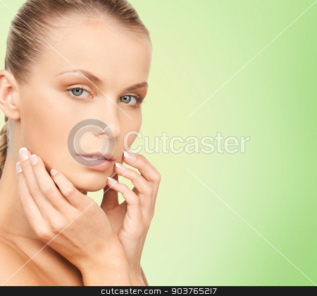 To use this stock image in your creative project, please select the size you need over to the right and click the "Add to Cart" button.
Your downloaded image will come with the Cutcaster watermark removed so don’t worry about the watermark you see on this page. beautiful young woman face stock photo, beauty, people and health concept - beautiful young woman touching her face over green background by Syda Productions