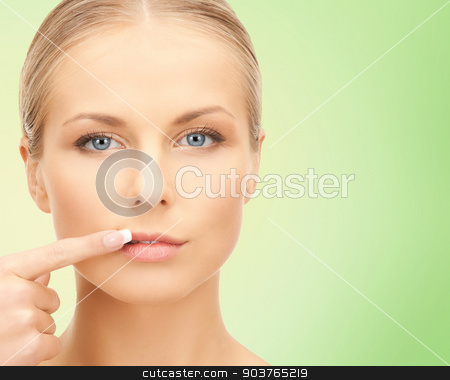 To use this stock image in your creative project, please select the size you need over to the right and click the "Add to Cart" button.
Your downloaded image will come with the Cutcaster watermark removed so don’t worry about the watermark you see on this page. beautiful young woman pointing finger to her lips stock photo, beauty, people and health concept - beautiful young woman pointing finger to her lips over green background by Syda Productions