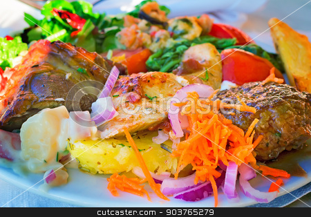To use this stock image in your creative project, please select the size you need over to the right and click the "Add to Cart" button.
Your downloaded image will come with the Cutcaster watermark removed so don’t worry about the watermark you see on this page. Stews and side dishes from a variety of vegetables. stock photo, On the table on a platter lies stews and side dishes from a variety of vegetables: carrots, onions, lettuce, tomatoes. by Georgina198