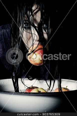 To use this stock image in your creative project, please select the size you need over to the right and click the "Add to Cart" button.
Your downloaded image will come with the Cutcaster watermark removed so don’t worry about the watermark you see on this page. Apple bobbing stock photo, young girl in a purple blouse plays apple bobbing by Suchota