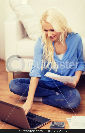 To use this stock image in your creative project, please select the size you need over to the right and click the "Add to Cart" button.
Your downloaded image will come with the Cutcaster watermark removed so don’t worry about the watermark you see on this page. smiling woman with papers, laptop and calculator stock photo, tax, finances, technology, home and happiness concept - smiling young woman with papers, laptop computer and calculator at home by Syda Productions