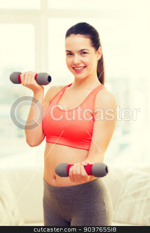 To use this stock image in your creative project, please select the size you need over to the right and click the "Add to Cart" button.
Your downloaded image will come with the Cutcaster watermark removed so don’t worry about the watermark you see on this page. smiling teenage girl exercising with dumbbells stock photo, fitness, home and diet concept - smiling redhead girl exercising with heavy dumbbells at home by Syda Productions