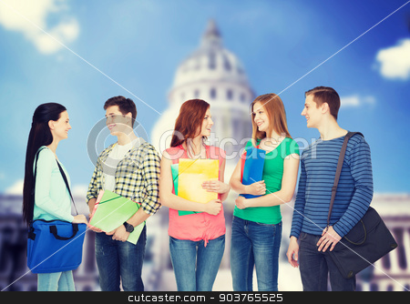 To use this stock image in your creative project, please select the size you need over to the right and click the "Add to Cart" button.
Your downloaded image will come with the Cutcaster watermark removed so don’t worry about the watermark you see on this page. group of smiling students standing stock photo, education and people concept - group of smiling students with bags and folders having discussion by Syda Productions