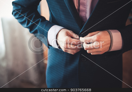 To use this stock image in your creative project, please select the size you need over to the right and click the "Add to Cart" button.
Your downloaded image will come with the Cutcaster watermark removed so don’t worry about the watermark you see on this page. men fastens his black suit stock photo, men fastens his black suit no face by Maksym Fesenko