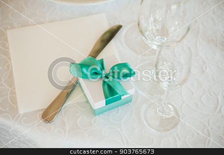 To use this stock image in your creative project, please select the size you need over to the right and click the "Add to Cart" button.
Your downloaded image will come with the Cutcaster watermark removed so don’t worry about the watermark you see on this page. box with green bow on table stock photo, wedding gift box with green bow on table by Maksym Fesenko