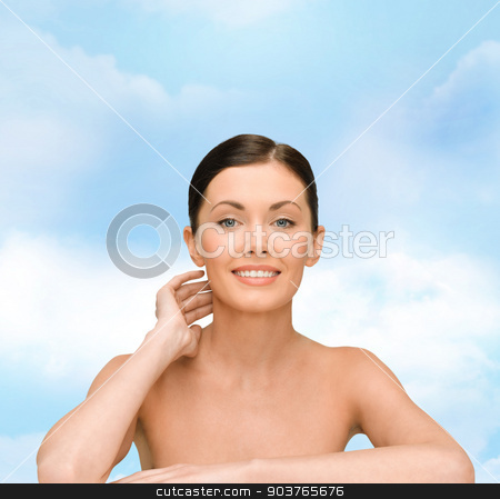 To use this stock image in your creative project, please select the size you need over to the right and click the "Add to Cart" button.
Your downloaded image will come with the Cutcaster watermark removed so don’t worry about the watermark you see on this page. smiling young woman with bare shoulders stock photo, beauty, people and health concept - smiling young woman with bare shoulders over blue sky background by Syda Productions