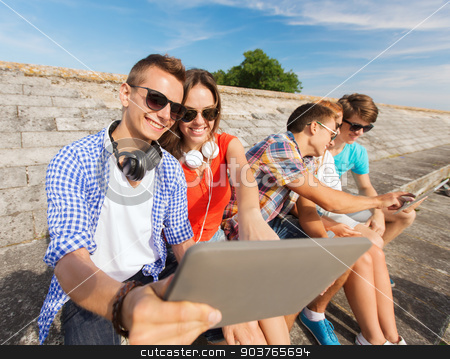 To use this stock image in your creative project, please select the size you need over to the right and click the "Add to Cart" button.
Your downloaded image will come with the Cutcaster watermark removed so don’t worry about the watermark you see on this page. group of smiling friends with tablet pc outdoors stock photo, friendship, leisure, summer and people concept - group of smiling friends with tablet pc computers sitting outdoors by Syda Productions