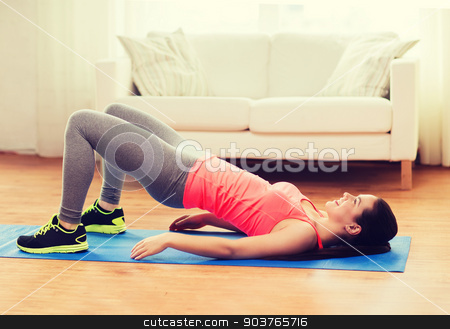 To use this stock image in your creative project, please select the size you need over to the right and click the "Add to Cart" button.
Your downloaded image will come with the Cutcaster watermark removed so don’t worry about the watermark you see on this page. smiling girl doing exercise for legs and buttocks stock photo, fitness, home and diet concept - smiling teenage girl doing exercise for legs and buttocks on floor at home by Syda Productions