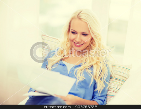 To use this stock image in your creative project, please select the size you need over to the right and click the "Add to Cart" button.
Your downloaded image will come with the Cutcaster watermark removed so don’t worry about the watermark you see on this page. smiling young woman with papers at home stock photo, tax, finances, home and happiness concept - smiling young woman with papers at home by Syda Productions