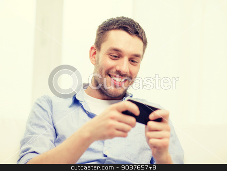 To use this stock image in your creative project, please select the size you need over to the right and click the "Add to Cart" button.
Your downloaded image will come with the Cutcaster watermark removed so don’t worry about the watermark you see on this page. smiling man with smartphone at home stock photo, home, technology and internet concept - smiling man with smartphone sitting on couch at home by Syda Productions