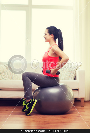 To use this stock image in your creative project, please select the size you need over to the right and click the "Add to Cart" button.
Your downloaded image will come with the Cutcaster watermark removed so don’t worry about the watermark you see on this page. smiling girl exercising with fitness ball stock photo, fitness, home and diet concept - smiling girl exercising with fitness ball and dumbbells at home by Syda Productions