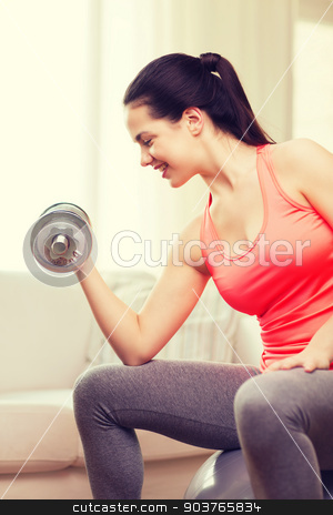 To use this stock image in your creative project, please select the size you need over to the right and click the "Add to Cart" button.
Your downloaded image will come with the Cutcaster watermark removed so don’t worry about the watermark you see on this page. smiling girl exercising with dumbbells stock photo, fitness, home and diet concept - smiling girl exercising with fitness ball and dumbbells at home by Syda Productions