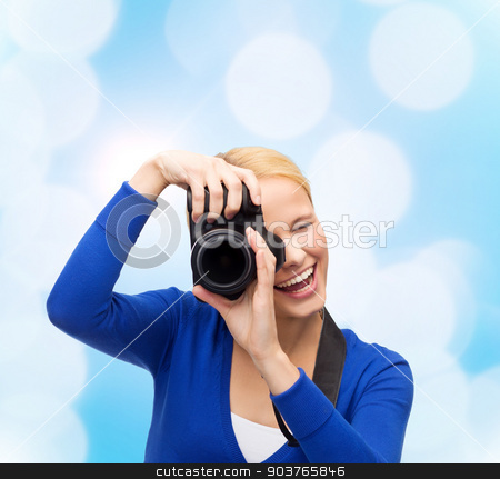 To use this stock image in your creative project, please select the size you need over to the right and click the "Add to Cart" button.
Your downloaded image will come with the Cutcaster watermark removed so don’t worry about the watermark you see on this page. smiling woman taking picture with digital camera stock photo, photography, technology and people concept - smiling young woman taking picture with digital camera over blue lights background by Syda Productions