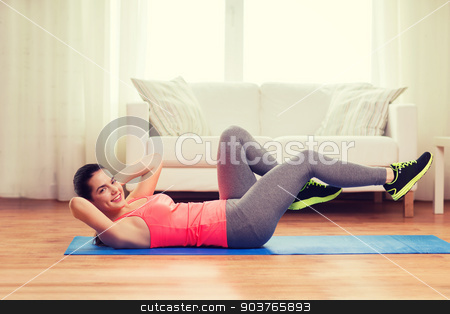 To use this stock image in your creative project, please select the size you need over to the right and click the "Add to Cart" button.
Your downloaded image will come with the Cutcaster watermark removed so don’t worry about the watermark you see on this page. smiling girl doing exercise on floor at home stock photo, fitness, home and diet concept - smiling teenage girl doing exercise on floor at home by Syda Productions