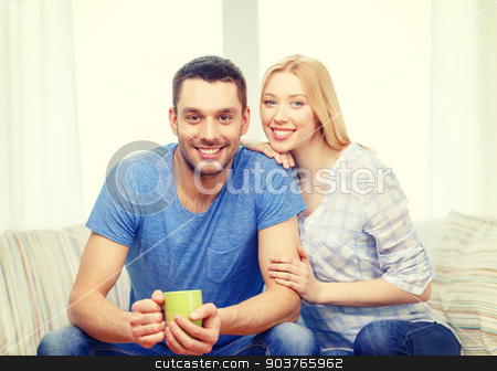 To use this stock image in your creative project, please select the size you need over to the right and click the "Add to Cart" button.
Your downloaded image will come with the Cutcaster watermark removed so don’t worry about the watermark you see on this page. smiling man with cup of tea or coffee with wife stock photo, love, family, healthy food and happiness concept - smiling man with cup of tea or coffee with wife or girlfriend at home by Syda Productions