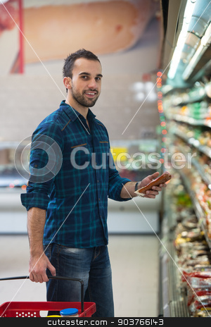 To use this stock image in your creative project, please select the size you need over to the right and click the "Add to Cart" button.
Your downloaded image will come with the Cutcaster watermark removed so don’t worry about the watermark you see on this page. Young Man Shopping In The Supermarket stock photo, Handsome Young Man Shopping For Fruits And Vegetables In Produce Department Of A Grocery Store - Supermarket - Shallow Deep Of Field by Jasminko Ibrakovic