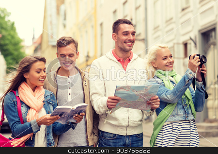 To use this stock image in your creative project, please select the size you need over to the right and click the "Add to Cart" button.
Your downloaded image will come with the Cutcaster watermark removed so don’t worry about the watermark you see on this page. group of friends with city guide, map and camera stock photo, travel, vacation, technology and friendship concept - group of smiling friends with city guide, photocamera and map exploring city by Syda Productions