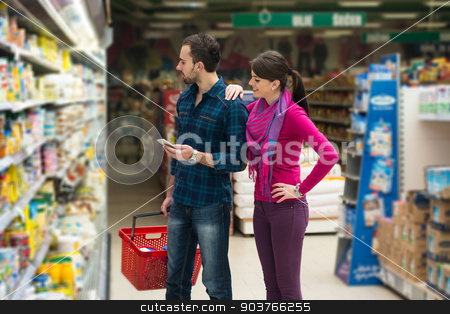 To use this stock image in your creative project, please select the size you need over to the right and click the "Add to Cart" button.
Your downloaded image will come with the Cutcaster watermark removed so don’t worry about the watermark you see on this page. Couple Shopping At The Supermarket stock photo, Beautiful Young Couple Shopping For Fruits And Vegetables In Produce Department Of A Grocery Store - Supermarket - Shallow Deep Of Field by Jasminko Ibrakovic