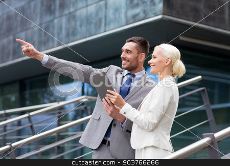 To use this stock image in your creative project, please select the size you need over to the right and click the "Add to Cart" button.
Your downloaded image will come with the Cutcaster watermark removed so don’t worry about the watermark you see on this page. smiling businessmen with tablet pc outdoors stock photo, business, partnership, technology and people concept - smiling businessman and businesswoman with tablet pc computer over office building by Syda Productions