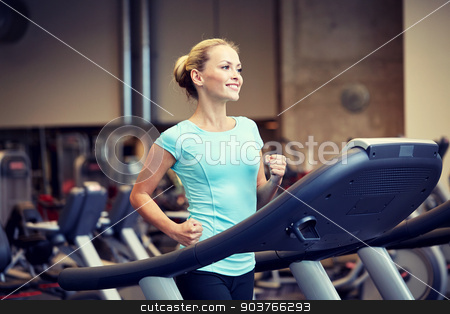 To use this stock image in your creative project, please select the size you need over to the right and click the "Add to Cart" button.
Your downloaded image will come with the Cutcaster watermark removed so don’t worry about the watermark you see on this page. smiling woman exercising on treadmill in gym stock photo, sport, fitness, lifestyle, technology and people concept - smiling woman exercising on treadmill in gym by Syda Productions