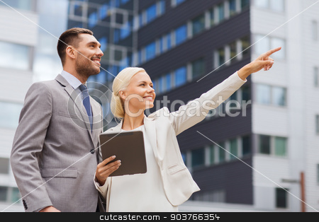 To use this stock image in your creative project, please select the size you need over to the right and click the "Add to Cart" button.
Your downloaded image will come with the Cutcaster watermark removed so don’t worry about the watermark you see on this page. smiling businessmen with tablet pc outdoors stock photo, business, partnership, technology and people concept - smiling businessman and businesswoman with tablet pc computer over office building by Syda Productions