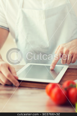 To use this stock image in your creative project, please select the size you need over to the right and click the "Add to Cart" button.
Your downloaded image will come with the Cutcaster watermark removed so don’t worry about the watermark you see on this page. closeup of man pointing finger to tablet pc stock photo, cooking, technology and home concept - closeup of man pointing finger to tablet pc computer by Syda Productions