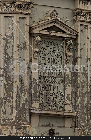 To use this stock image in your creative project, please select the size you need over to the right and click the "Add to Cart" button.
Your downloaded image will come with the Cutcaster watermark removed so don’t worry about the watermark you see on this page. Hotel Sign stock photo, Paint Peeling Hotel Sign from the Prince Patrick Hotel. by Ron Kidd