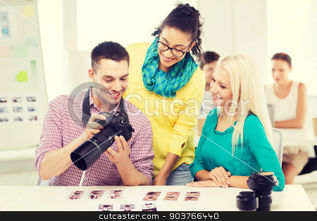 To use this stock image in your creative project, please select the size you need over to the right and click the "Add to Cart" button.
Your downloaded image will come with the Cutcaster watermark removed so don’t worry about the watermark you see on this page. smiling team with photocamera working in office stock photo, business, education, photography, office and startup concept - smiling creative team with photocamera working in office by Syda Productions