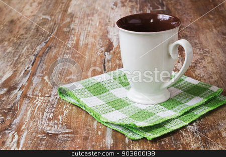 To use this stock image in your creative project, please select the size you need over to the right and click the "Add to Cart" button.
Your downloaded image will come with the Cutcaster watermark removed so don’t worry about the watermark you see on this page. white tea cup stock photo, white tea cup on a kitchen towel on wooden background. dishes and kitchen equipment. copy space background by Jevgeni Proshin