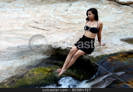 To use this stock image in your creative project, please select the size you need over to the right and click the "Add to Cart" button.
Your downloaded image will come with the Cutcaster watermark removed so don’t worry about the watermark you see on this page. Hispanic Woman Waterfall stock photo, Hispanic woman with bikini sitting next to a waterfall. by Henrik Lehnerer