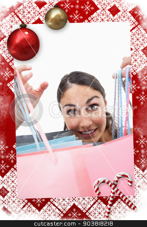 To use this stock image in your creative project, please select the size you need over to the right and click the "Add to Cart" button.
Your downloaded image will come with the Cutcaster watermark removed so don’t worry about the watermark you see on this page. Composite image of portrait of a cheerful woman showing shopping stock photo, Portrait of a cheerful woman showing shopping bags against christmas themed page by Wavebreak Media