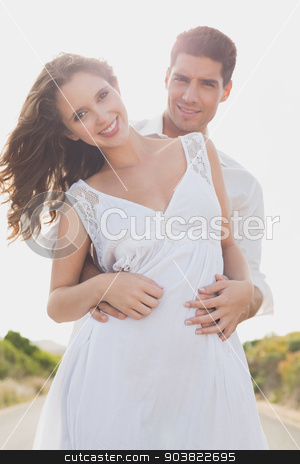 To use this stock image in your creative project, please select the size you need over to the right and click the "Add to Cart" button.
Your downloaded image will come with the Cutcaster watermark removed so don’t worry about the watermark you see on this page. Loving couple standing on countryside road stock photo, Portrait of a loving young couple standing on countryside road by Wavebreak Media